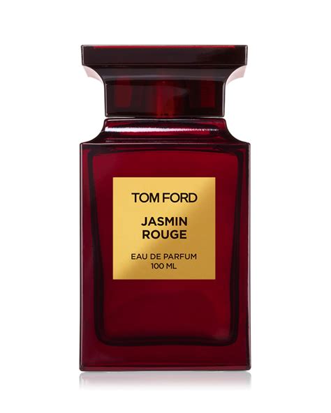 Prabangi Tom Ford Jasmin Rouge lūpų dažų pakuotė ir atidarytas lūpdažis ant elegantiško fono