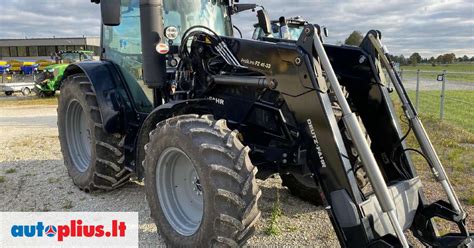 Nuotrauka su MTZ traktoriaus priekine ašimi ir vairo mechanizmu
