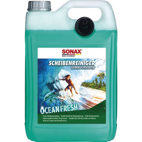 Thematic photo of SONAX Ocean Fresh 4L bottle with a car in the background