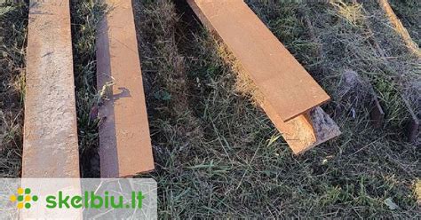 nuotrauka, vaizduojanti plieninės sijos tvirtinimą ant tralo reketo diržais