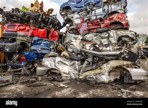 Photo of a car dismantling yard with various car models
